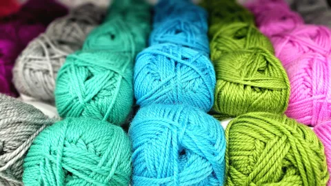 Several variations of colored yarn.