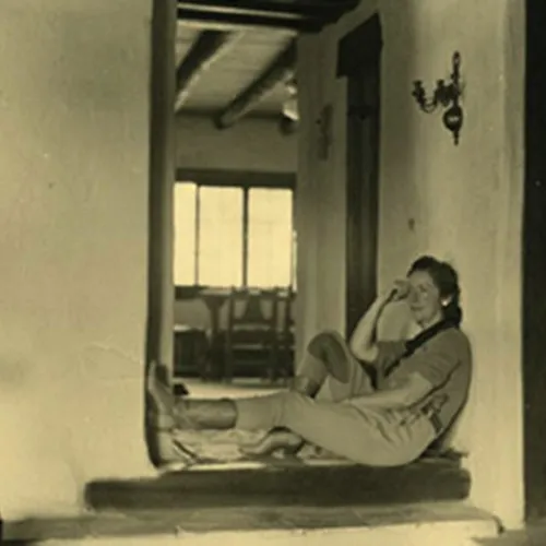 Dot Heller sitting in a doorway